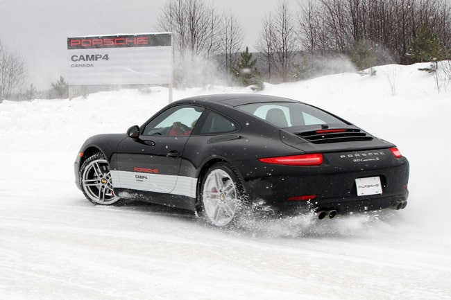Porsche Camp4 Canada black 911 snow drifting rear view