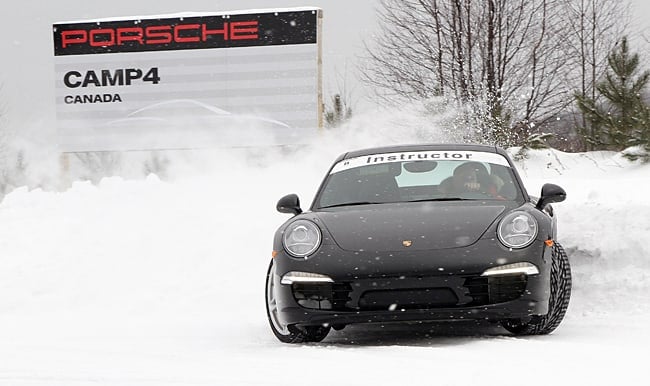 Porsche Camp4 Canada black car front view in snow